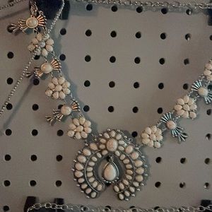 This is a huge cream turquoise piece that has silver chain throughout